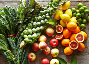 a group of fruits and vegetables on a wood surface Healthy Weight Loss Diets Blandford Forum